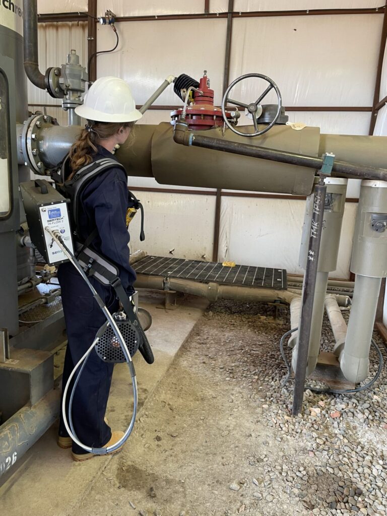 Scientist with a gas sensor