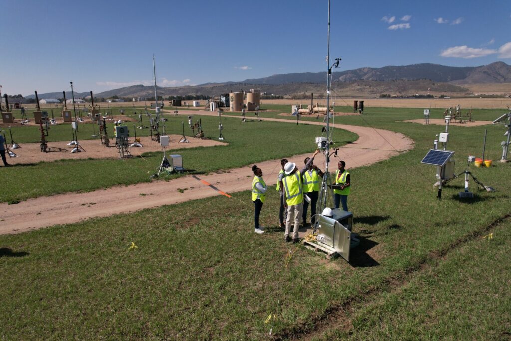 Scientists examining sensor equipment